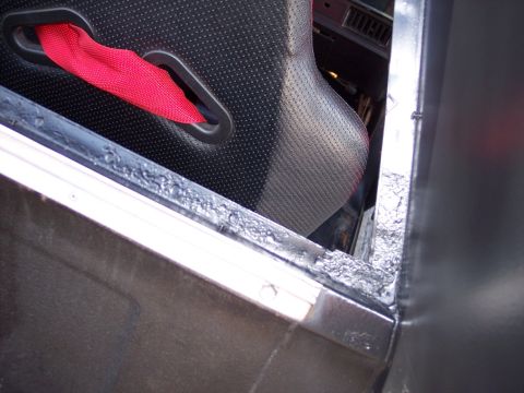 1972 Ford Ranchero - Interior view showing a racing seat and red harness.