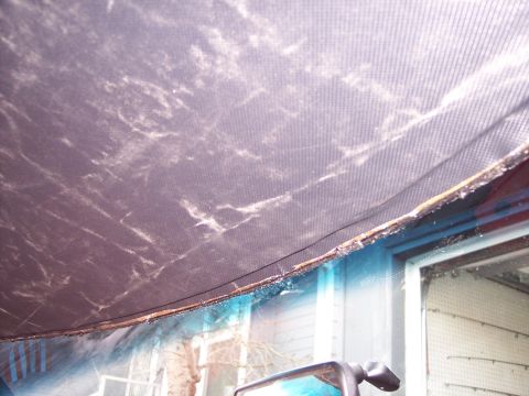 1972 Ford Ranchero - The interior headliner shows signs of water damage and wear, with visible fraying along the edges.