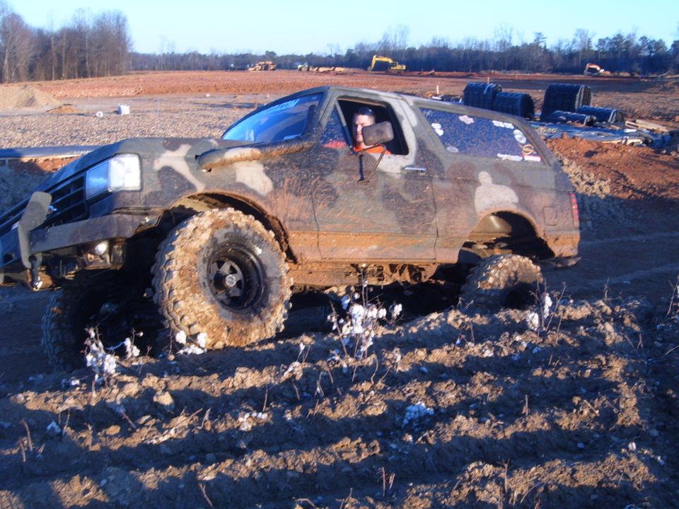 Muddy 1987 Ford Bronco off-roading