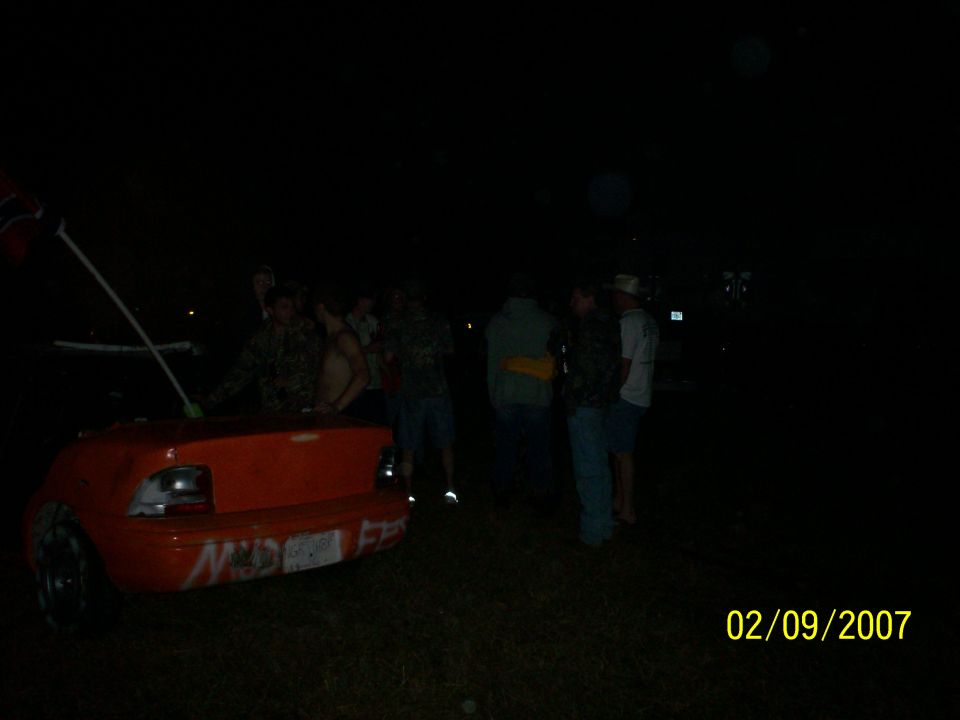 Orange car trunk with graffiti, rear view
