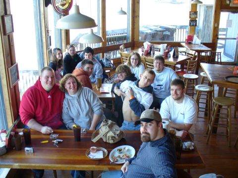 1991 Ford Probe - A group of friends and family enjoy a meal together inside a casual dining establishment.