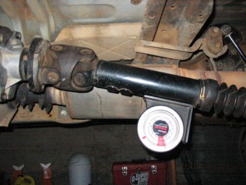 1995 Ford Bronco - A driveshaft is shown with an angle gauge attached to measure its pitch.