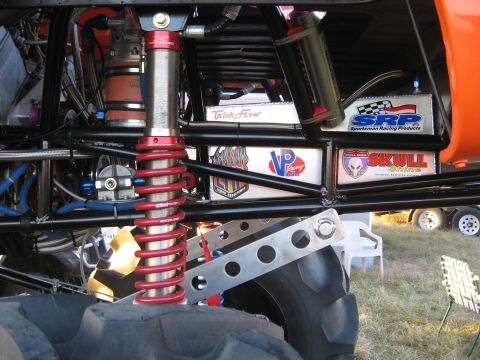 1974 Ford F-100 - Custom suspension and engine bay details on a monster truck, racing decals.