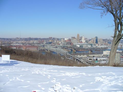 1991 Ford Probe - A wide view of a city skyline and bridges on a clear, cold day with snow on the ground.