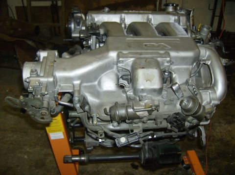 1996 Ford Probe - Engine assembly with visible intake manifold and throttle body components.