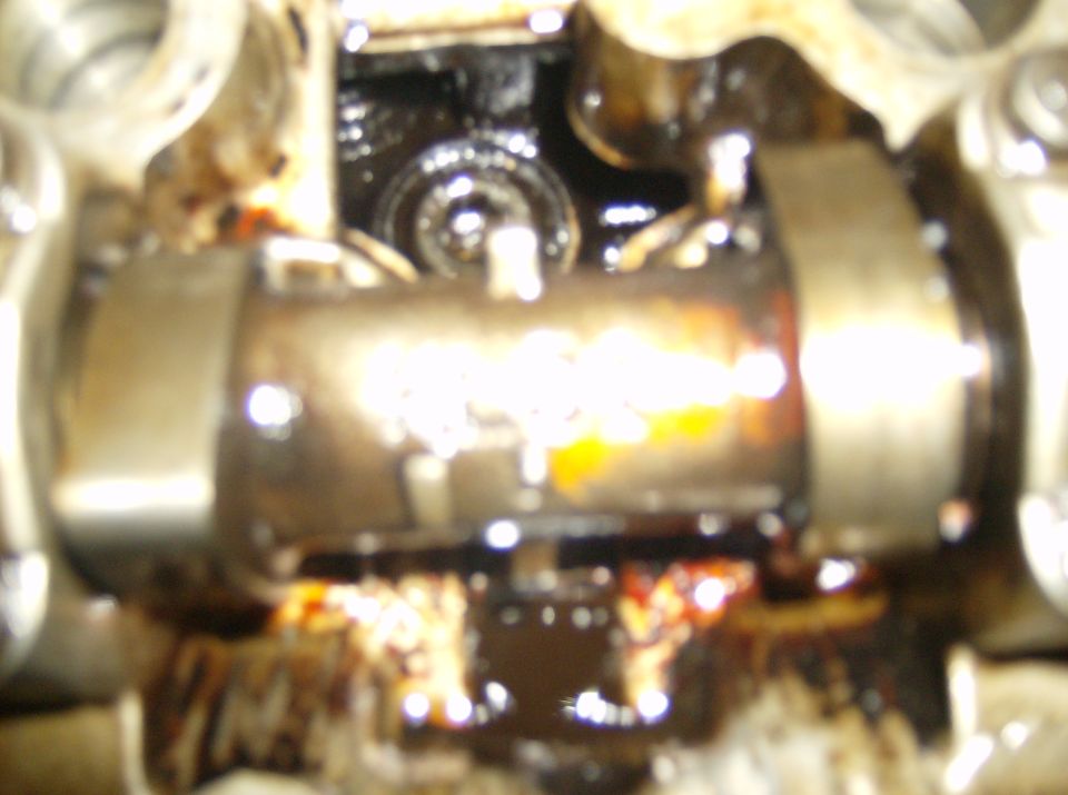 Close-up of engine's valve train with oil