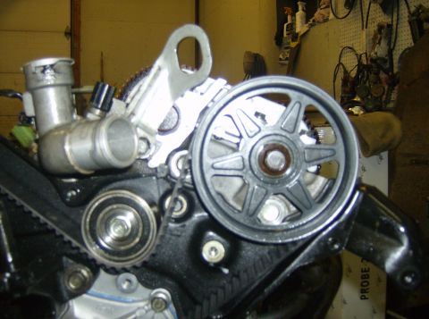 1996 Ford Probe - This image shows a close-up view of an engine's timing belt and pulley system, likely during a repair or maintenance procedure.