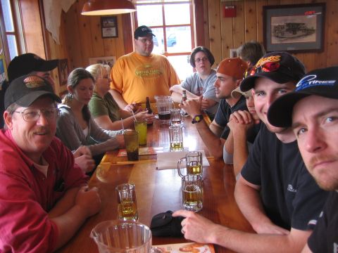 1996 Ford Bronco - A group of friends gathered around a table, enjoying drinks and conversation in a casual setting.
