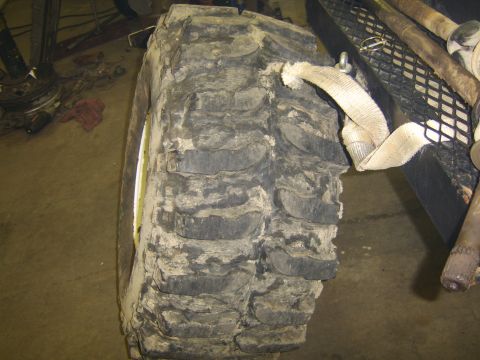 1986 Ford Ranger - A close-up view of a large, aggressive off-road tire, likely modified for terrain.