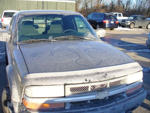1991 Ford Probe - Pickup truck's front end is frosted over, obscuring the grille and headlights.