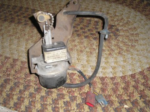 1990 Ford Bronco - Vacuum brake booster assembly with label and wiring, likely a replacement part.