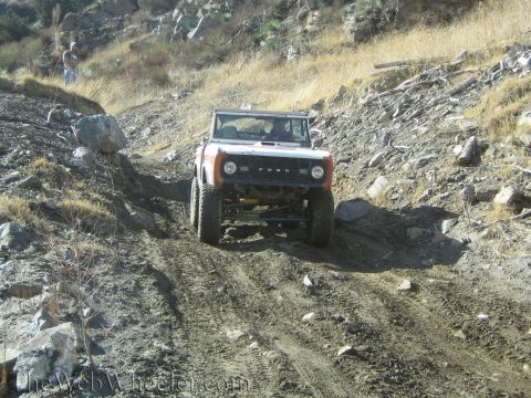 1987 Suzuki Samurai - This classic Ford Bronco navigates a challenging off-road course, its capabilities.