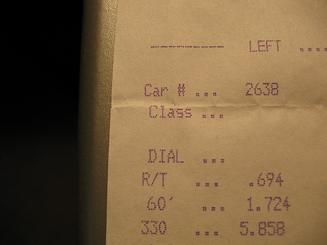 Close-up of a drag strip time slip showing car number 2638, R/T of .694, and 60' time of 1.724