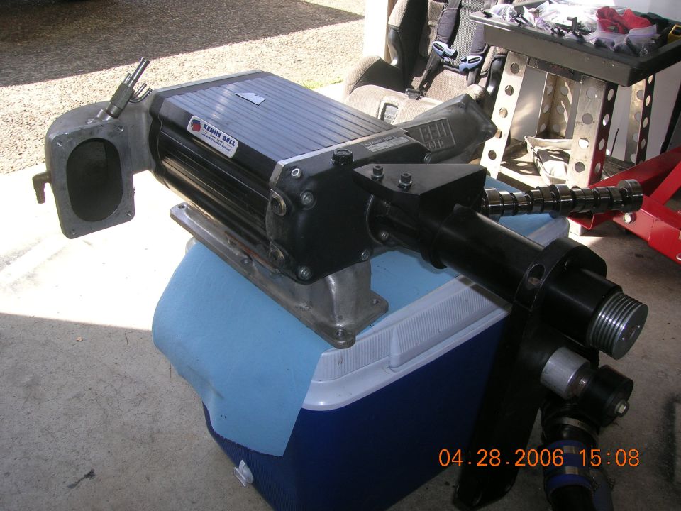 Kenne Bell supercharger sitting on a cooler. Camshaft visible