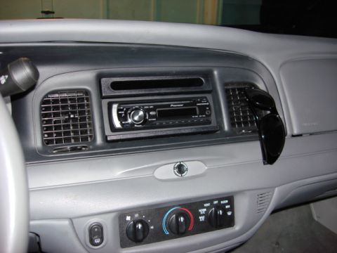 2003 Ford Crown Victoria - Dashboard of a 2003 Ford Crown Victoria, an aftermarket Pioneer radio and air vents.
