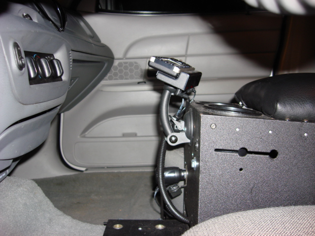 2003 Ford Crown Victoria interior console with radio equipment and cup holders