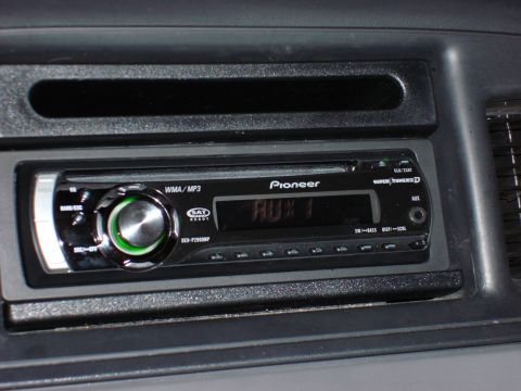 2003 Ford Crown Victoria - Close-up of a Pioneer car stereo system installed in a vehicle's dashboard.