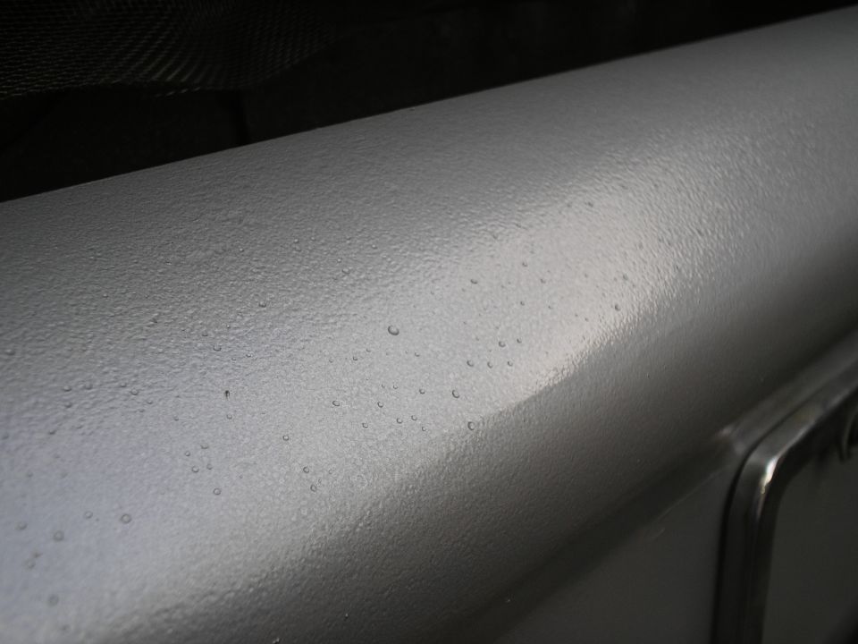 close up finish of bumper showing the texture of the hammered silver paint