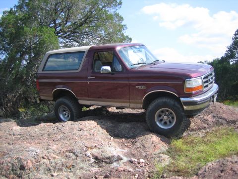 1996 Ford Bronco - This 1996 Ford Bronco is shown off-road on a rocky landscape.