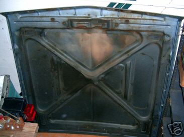 1967 Ford Ranchero - Underside of a car hood, likely from an older model vehicle.