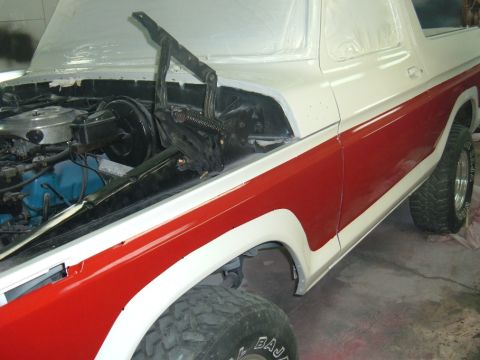 1978 Ford Bronco - This 1978 Ford Bronco is undergoing a paint job, with the hood open to reveal the engine compartment.