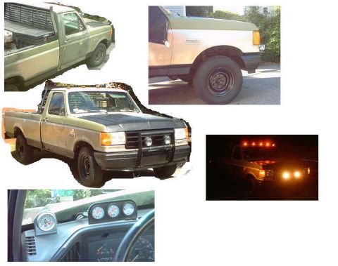 1979 Ford Bronco - This Ford F-Series pickup truck has a two-tone paint job and a modified front end.