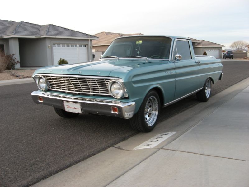 Teal Ford Ranchero pickup, front 3/4 view, parked on residential street