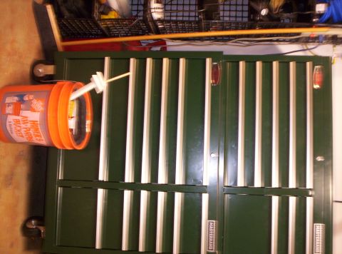 1995 Ford Bronco - A green tool chest is shown with an orange bucket attached to its side.