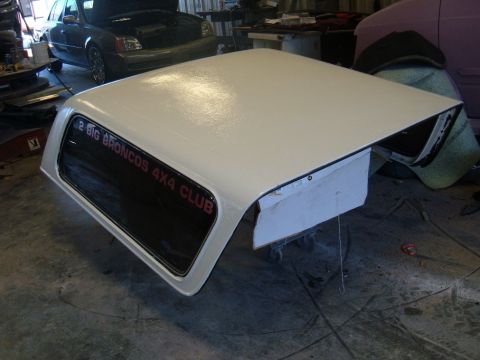 1978 Ford Bronco - A white Ford Bronco hardtop is shown in a garage, with text on the rear window.