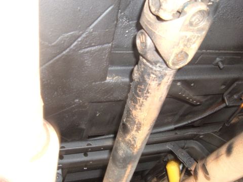 1978 Ford Bronco - Close-up of the underbody, showing the driveshaft and protective floor coating.