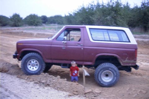 1980 Ford Bronco - son standing next to truck during first suspension ck