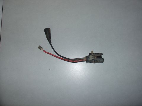 1988 Ford Bronco - A single electrical connector with two wires and a protective boot is shown against a plain background.