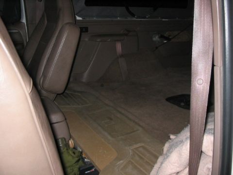 1995 Ford Bronco - The interior of a vehicle is shown, with a focus on the seats and floor.