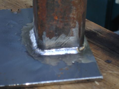 1989 Ford Bronco - A metal post is securely attached to a flat metal base with a visible weld bead.