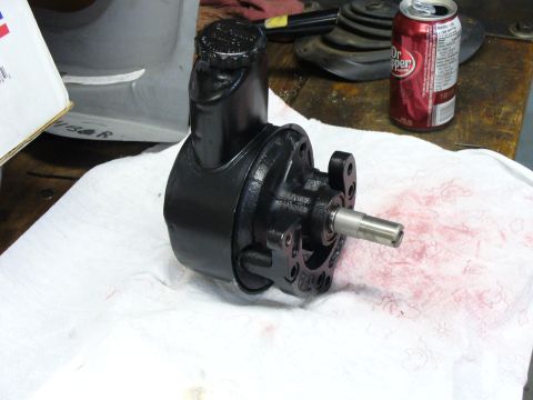 1978 Ford Bronco - A black power steering pump is shown on a white paper towel, with a Dr. Pepper can visible in the background.