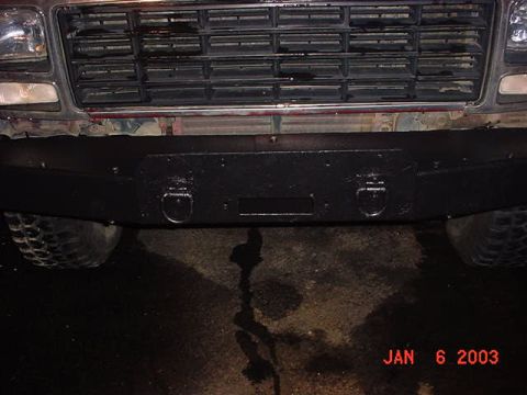 1980 Ford Bronco - Aftermarket front bumper with tow hooks and license plate mount.