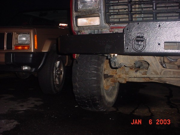 with the bumper finally modified and all tightened down I have some fender hanging down lower than the bumper its self so I cut it off                   pre cut rt front side