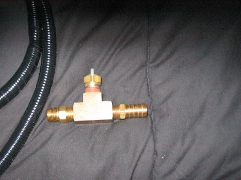 1991 Ford Bronco - Brass T-fitting with hose barb and threaded male end, next to a black ribbed hose.