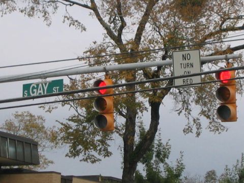 1979 Ford Bronco - Street signs and traffic signals are visible on an overcast day.