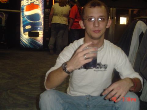 1995 Ford Probe - A man sits on the floor with a drink in hand, with a Pepsi vending machine in the background.