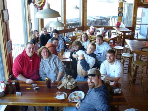 1995 Ford Probe - A group of friends gathers at tables inside a restaurant, enjoying a meal and each other's company.