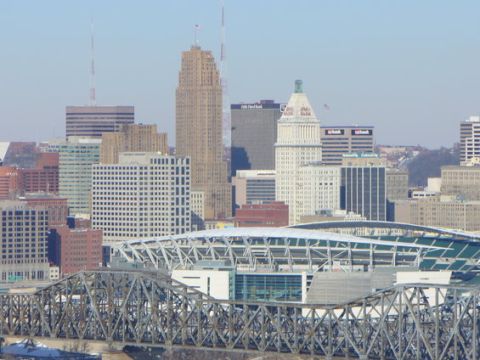 1995 Ford Probe - A wide view of the Cincinnati skyline, a stadium and a large bridge in the foreground.
