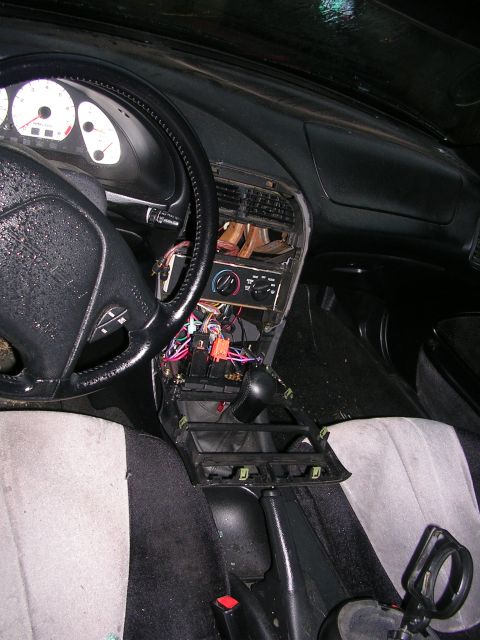 1996 Ford Probe - Interior view of a 1996 Ford Probe with the center console removed, exposing wiring.