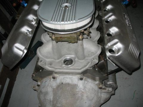1964 Ford 427 - Ford V8 engine components including intake, carburetor, and valve covers.