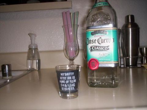 1989 Ford Bronco - Bar setup includes a bottle of Jose Cuervo, a shot glass with text, and a cocktail shaker.
