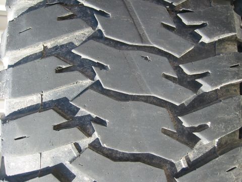 1966 Ford Bronco - This image shows the aggressive tread pattern of an off-road tire, likely for a truck or SUV.
