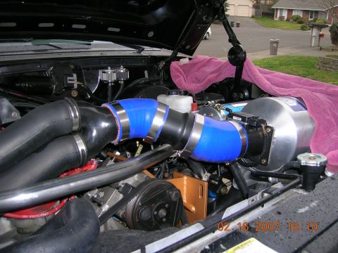 1996 Ford Bronco - Custom intake system installed in the engine bay, partially covered by a towel.