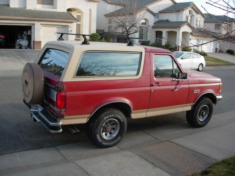 1990 Ford Bronco - This 1990 Ford Bronco is seen from a three-quarter front angle on a residential street.