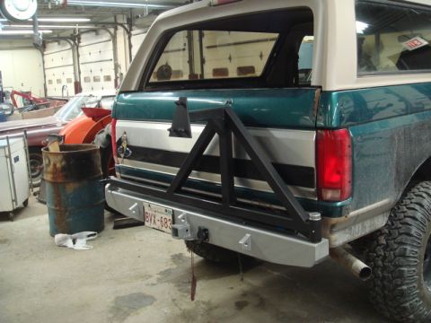 1996 Ford Bronco - Rear view of a Ford Bronco with a custom bumper and spare tire mount.
