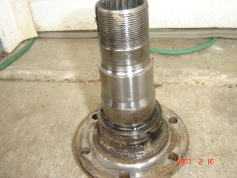 1993 Ford Bronco - Close-up of a wheel hub assembly, showing the threaded shaft and mounting flange.